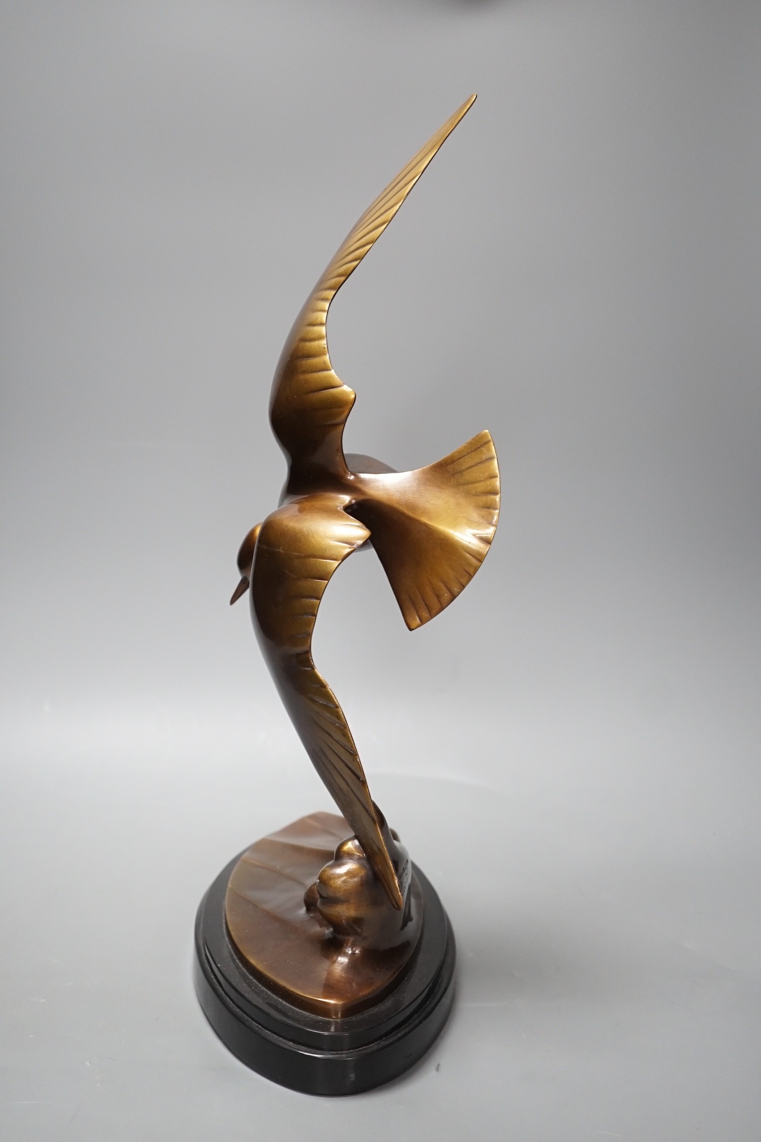 An Art Deco patinated bronze figure of a seabird, signed J B Leonard, 47 cms high